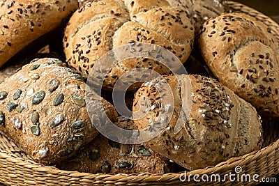 Wicker basket with selection of breads and pastries. Assortment of baked products Stock Photo