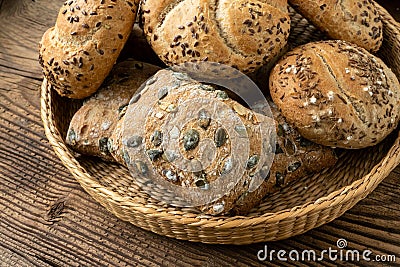 Wicker basket with selection of breads and pastries. Assortment of baked products Stock Photo