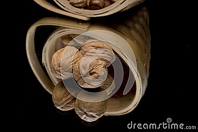 Wicker basket with walnuts Stock Photo