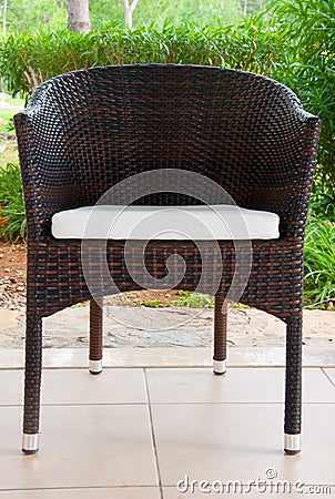 Wicker chair on terrace Stock Photo