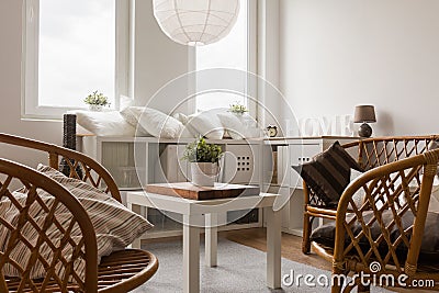 Wicker chairs and white table Stock Photo