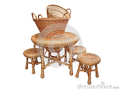 Wicker furniture - table, chair and baskets isolated over white Stock Photo