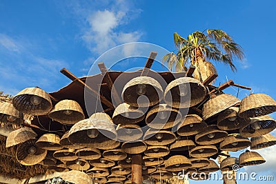 wicker lanterns against a background of blue sky Stock Photo