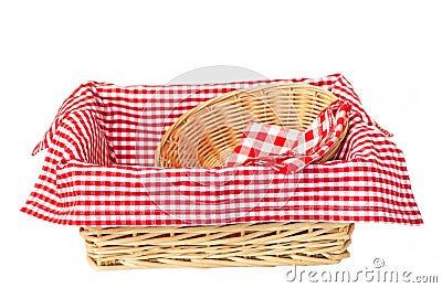 Wicker oval basket with a red checkered napkin isolated on white background Stock Photo