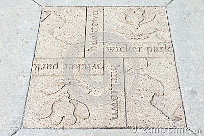 Wicker Park and Bucktown Sign on the Sidewalk in the Wicker Park Neighborhood of Chicago Editorial Stock Photo