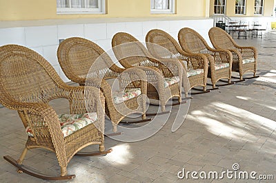 Wicker rockers waiting for you! Stock Photo