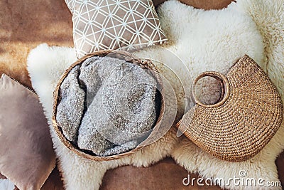 Wicker storage basket and bag as interior decor Stock Photo