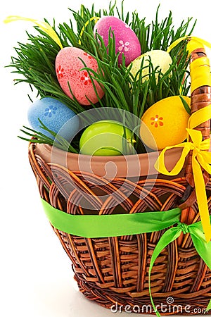 Wicker wooden basket with Easter eggs and fresh grass, part, fro Stock Photo