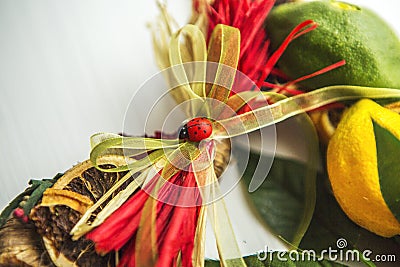 Wicker wreath with heart-shaped, decorated with leaves, lemon, dried lemon Stock Photo