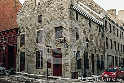 Wide angle of Corner Street, and Old Architectural buildings in the heart of Old Montreal - dec, 2019 Editorial Stock Photo