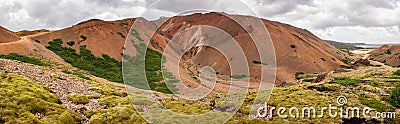 Wide angle panorama of red mountains of Lonsoraefi in Iceland Stock Photo