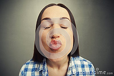 Wide angle portrait of kissing woman Stock Photo