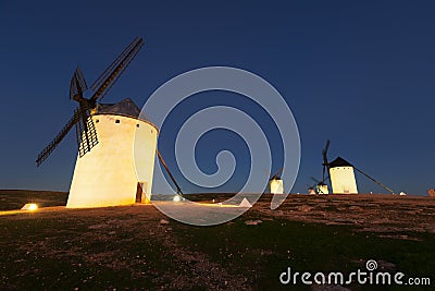 Wide angle shot of group of windmills in night Stock Photo