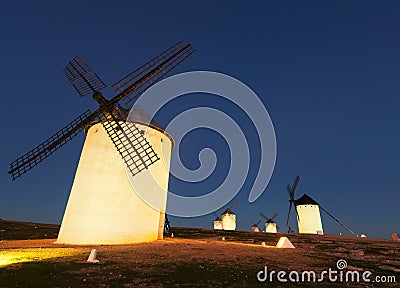 Wide angle shot of group of windmills in night Stock Photo