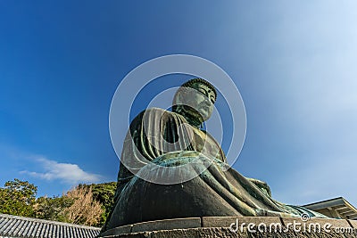 Wide angle side view of The Great Buddha (Daibutsu) of Kamakura, Japan Stock Photo