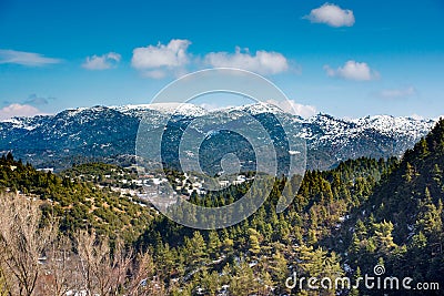 A wide-angle sunny,autumn midday view of snow coated Helmos mountain which located in Peloponnese. Grecce Stock Photo
