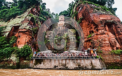 Wide angle view of Leshan Giant Buddha or Dafo from river boat in Leshan China Stock Photo