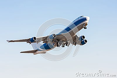 Wide body cargo airplane in the air Stock Photo