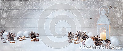 Wide christmas background with a candle light lantern, baubles, Stock Photo