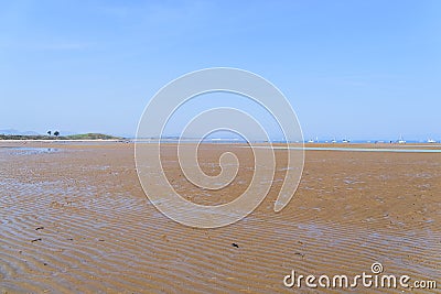 The wide expanse of Llanbedrog beach in Wales at low tide on a summer day Stock Photo