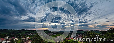 Wide hires panoramic landscape view of green valley in Schwartzwald at sunset Stock Photo