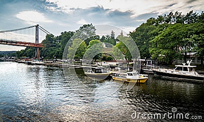 A wide horizontal view of boats docked at the TR Gallo Waterfront Park and marina on he Rondout Editorial Stock Photo