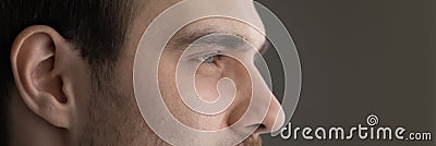 Wide image banner dreamy motivated man eyes cropped close up Stock Photo