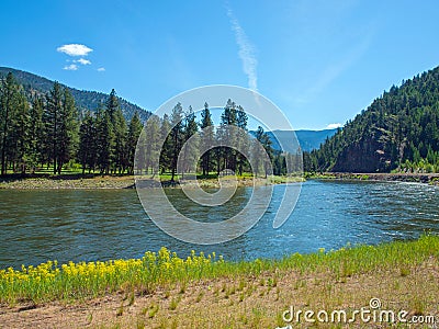 Wide Mountain River Cuts a Valley - Clark Fork River Stock Photo