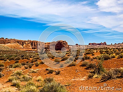 Wide open desert landscape filled with desert vegetation, Arches National Park, UT, USA Stock Photo