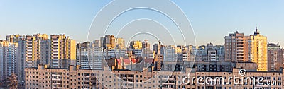 Wide panorama view of residential high-rise buildings, in the evening at sunset Stock Photo