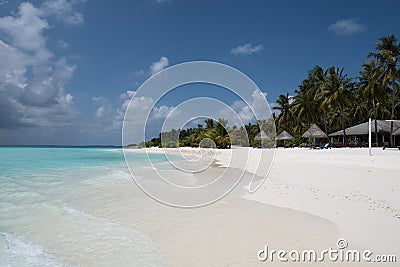 Wide sandy beach on a tropical island in Maldives Stock Photo