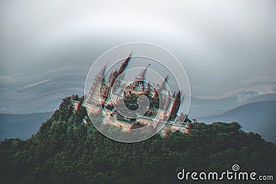 Wide shot of a turned trippy castle with on greenery with grey skies above Stock Photo