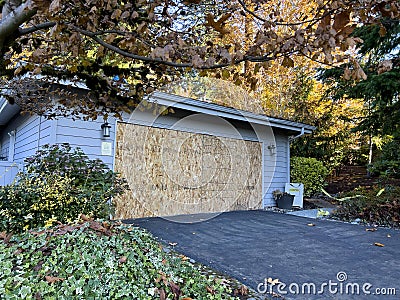 Wide view of the front of a condemned house after a wild fire caused smoke damage Stock Photo