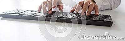 Wide view image of programmer using computer keyboard Stock Photo