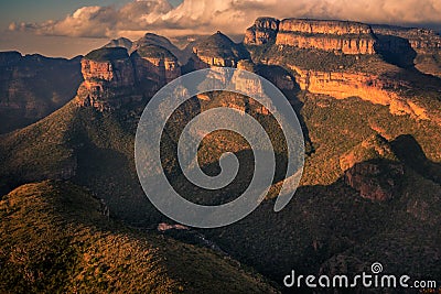 Wide view of the Three Rondavels and surrounding mountain cliffs Stock Photo