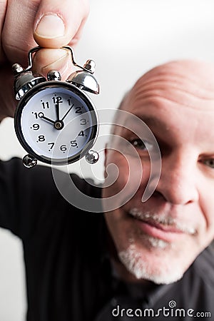 Wideangle closeup man with time passing Stock Photo