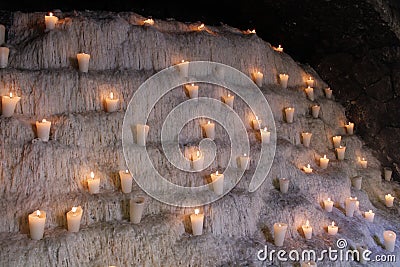 Wider view of Candles over wax in many floors Editorial Stock Photo
