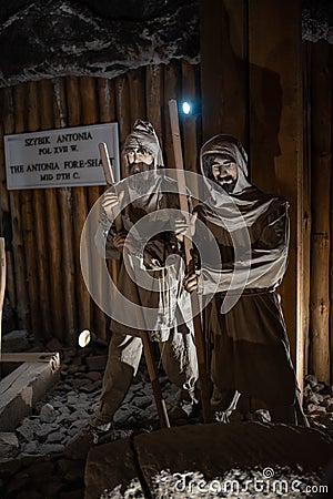 Wieliczka Salt Mine underground scene with miners near Krakow, Poland, tourist landmark Editorial Stock Photo