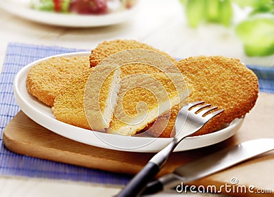 Wiener schnitzel served on a white plate Stock Photo