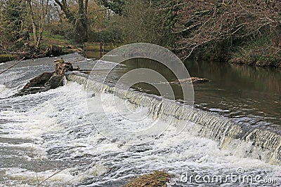 Wier on the River Culm, Devon Stock Photo