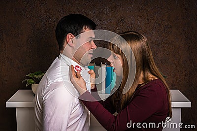 Wife finded red lipstick on shirt collar - infidelity concept Stock Photo