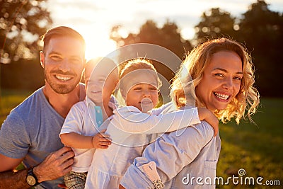 Wife and husband with children in nature Stock Photo