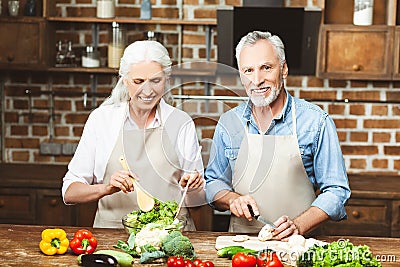 Wife and husband cooking salad Stock Photo