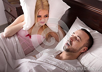 Wife and husband snoring in sleep Stock Photo