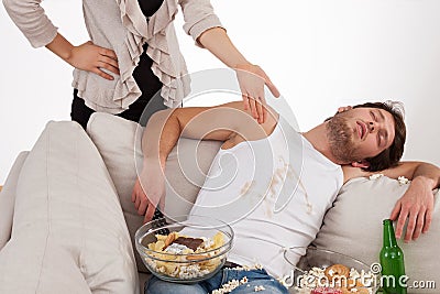 Wife and lazy husband Stock Photo