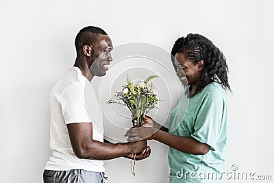 Wife receives a bouquet of flowers from her husband Stock Photo