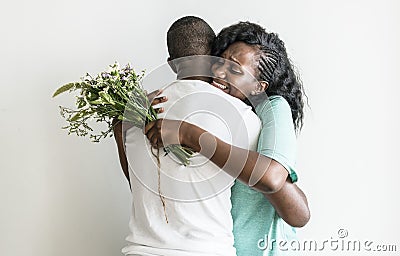 Wife receives a bouquet of flowers from her husband Stock Photo