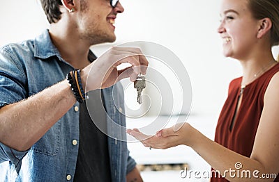 Wife receives a house key from husband Stock Photo