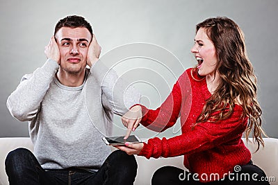 Wife shouting at husband. Cheating man. Betrayal. Stock Photo