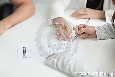 Wife signing divorce decree after break up decision Stock Photo